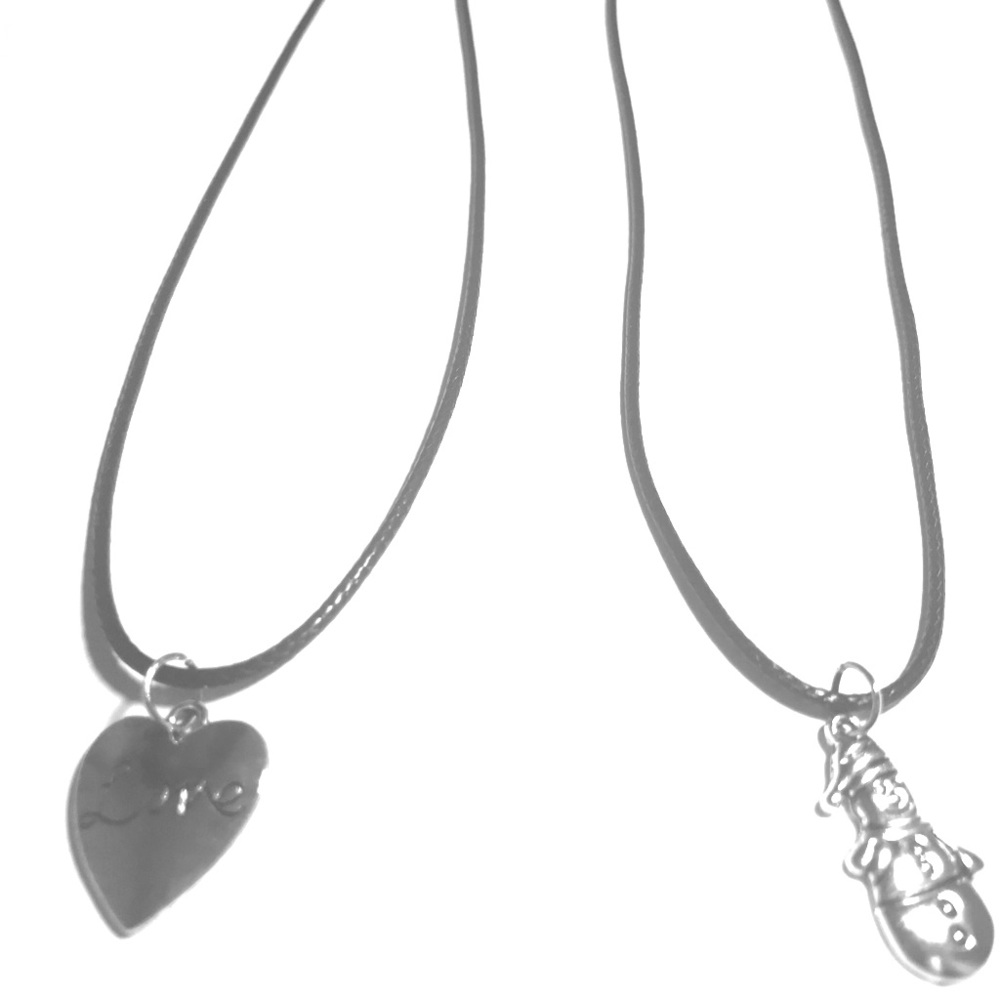 Two black cord necklaces with two charms.